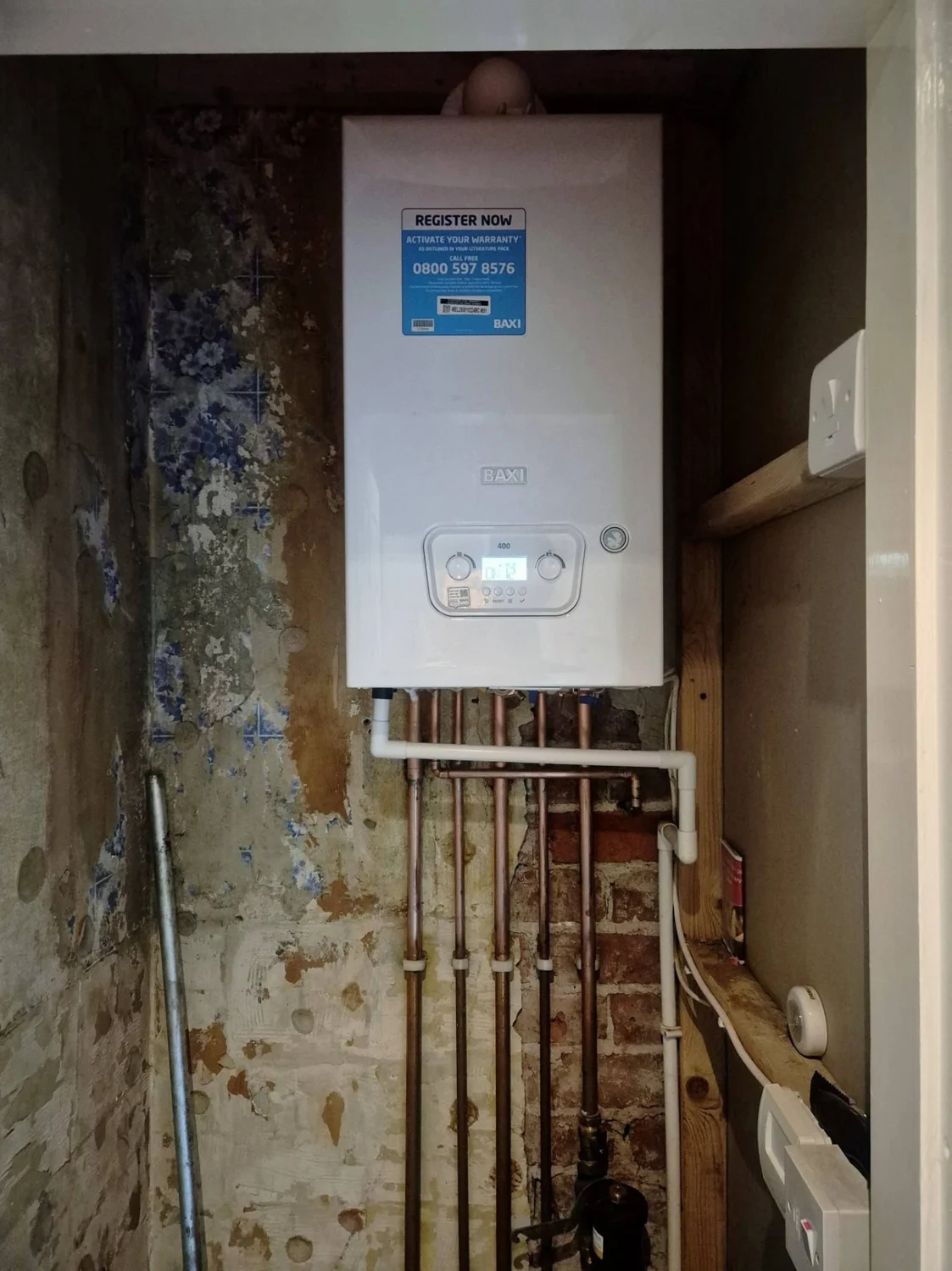 Installed Baxi boiler with associated copper pipework